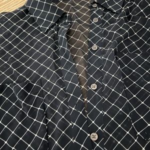 Black sheer long sleeve shirt.